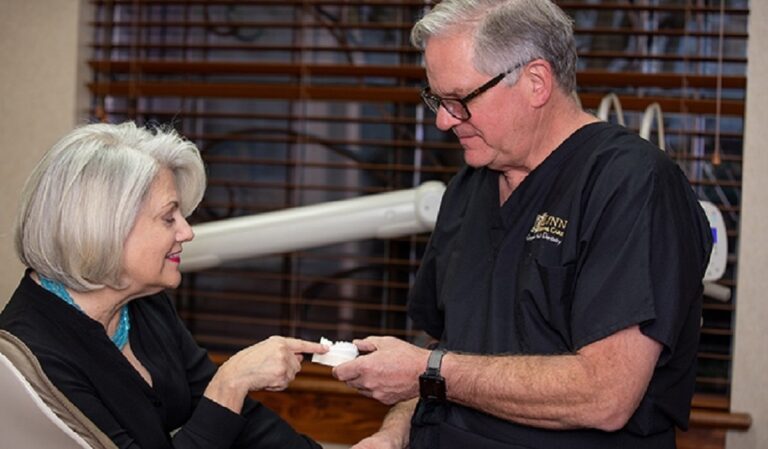 Dalls dentist Dr. Brock Lynn explaining dental implant and dental crown options at Lynn Dental Care 768x449