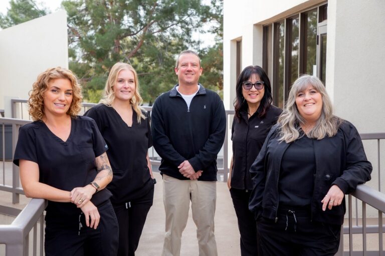 Scottsdale dentist Dr. Alex Martin DDS with his team outside his office 768x512